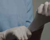 Image of a surgeon putting on gloves