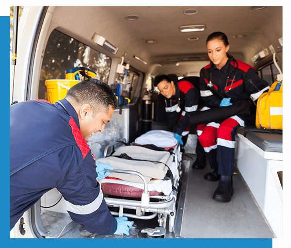 VSAESI – IMG 1 Image of emergency paramedics taking a stretcher out of an ambulance