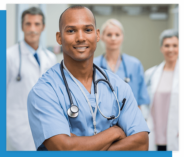 Image of a confident surgeon with 3 other nurses and doctors in the background